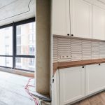 Comparison of old room before restoration and new renovated kitchen with large panoramic window, parquet floor and kitchen furniture. Photo collage of modern apartment before and after renovation.